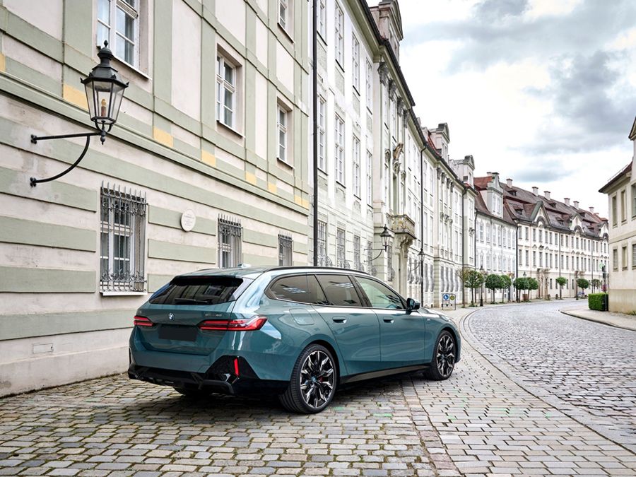 BMW i5 Touring on a street