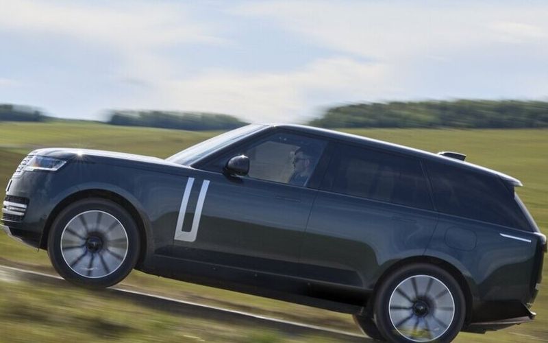 Range Rover Electric Driving Up A Hill