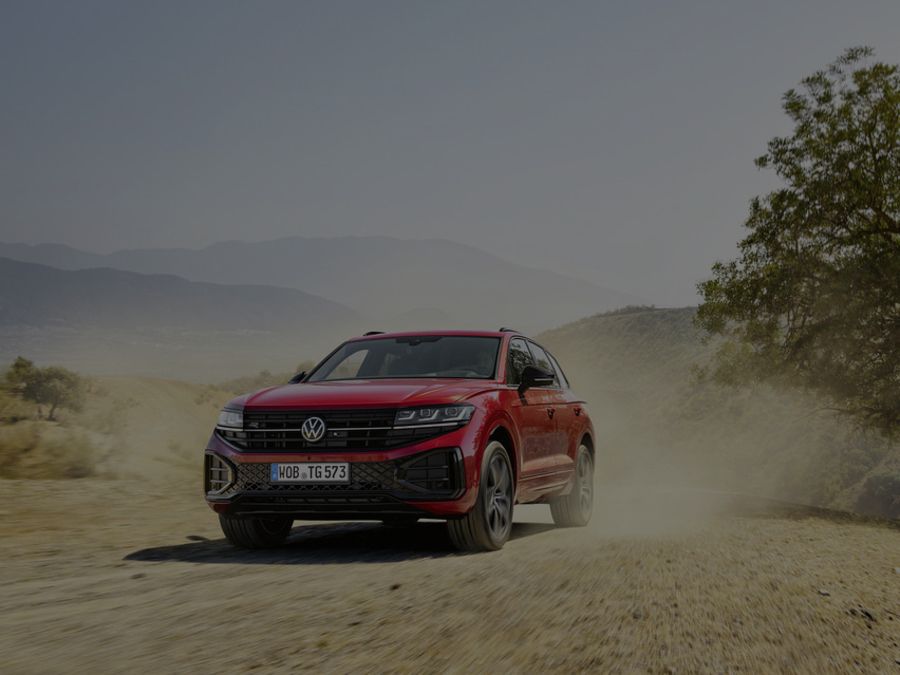 Volkswagen Touareg Driving In A Desert Scene